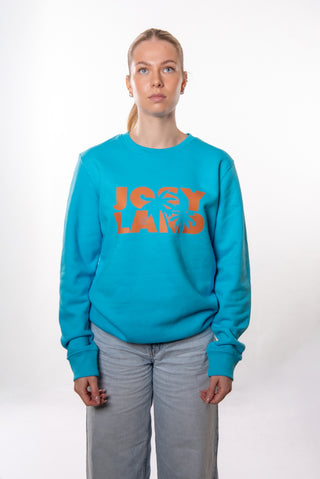 Unisex JOSYLAND Palmen Sweater aus weichem Sweatstoff mit Palmenmuster, getragen von einer Person, modisch und bequem.